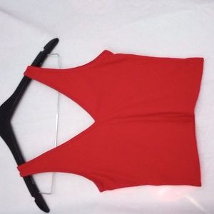 sleeveless, ribbed tank features a front and back V-cut in a crop silhouette